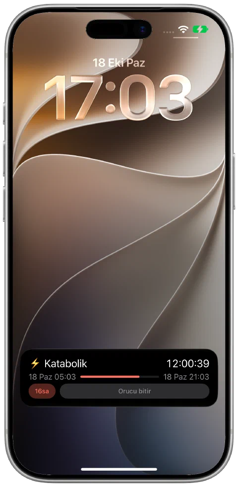 iPhone Kilitli Ekranında Fasty Canlı Etkinliği; etkin zamanlayıcı, hedef ilerlemesi ve orucu bitirme kontrolüyle.